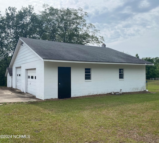 garage featuring a yard