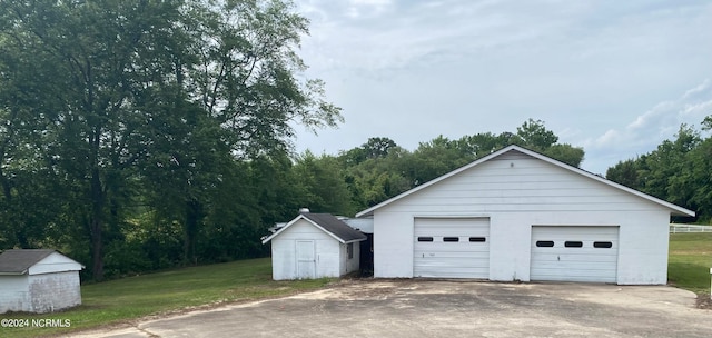 garage featuring a yard