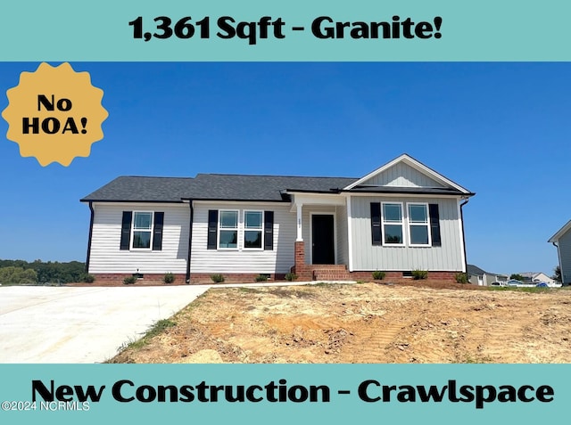 view of front of house with crawl space and board and batten siding