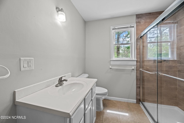 bathroom with tile patterned floors, walk in shower, toilet, and vanity