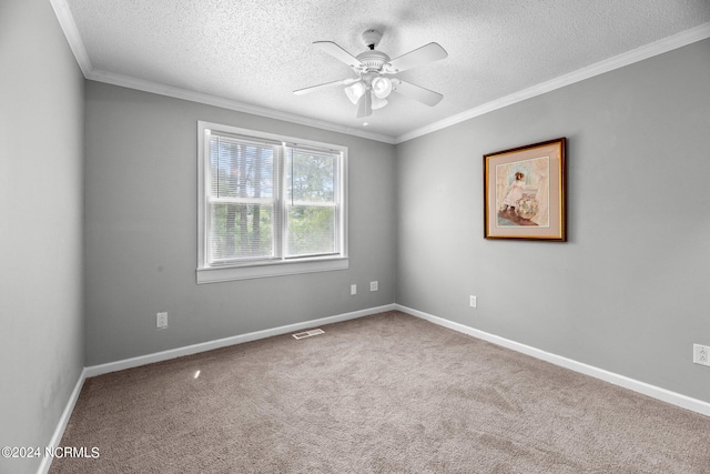 spare room with ceiling fan, carpet, and a textured ceiling