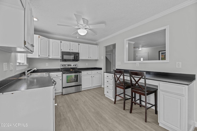 kitchen with crown molding, sink, white cabinetry, ceiling fan, and electric stove