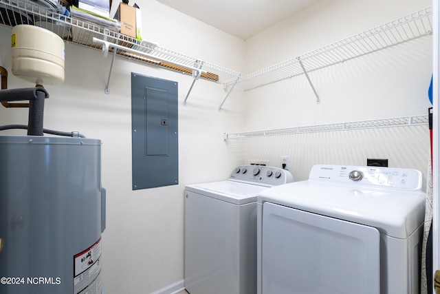 clothes washing area with washing machine and dryer and electric water heater