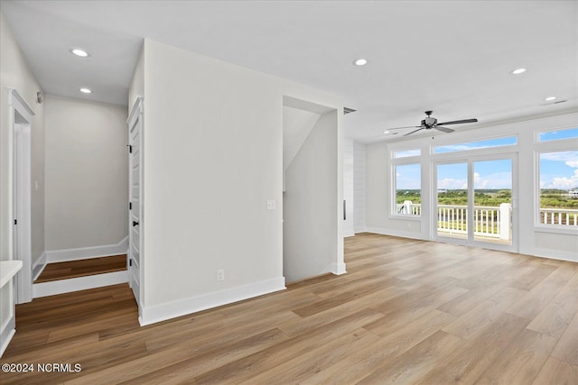 interior space featuring a wealth of natural light, baseboards, light wood finished floors, and recessed lighting