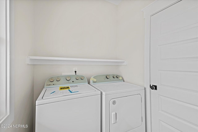 washroom featuring laundry area and washer and dryer