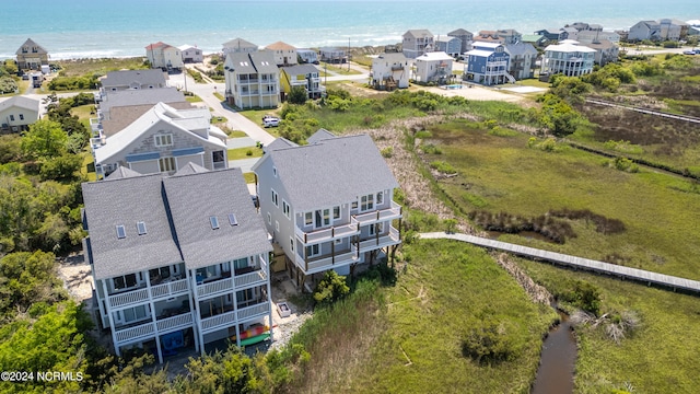 aerial view featuring a water view and a residential view