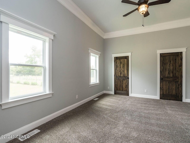 unfurnished bedroom featuring carpet, ceiling fan, and ornamental molding