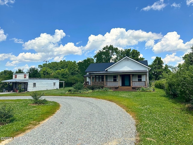 view of front of house featuring a porch and a front lawn