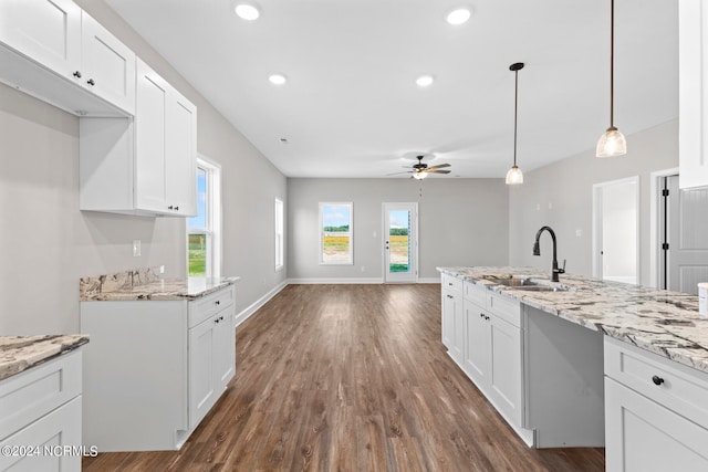 kitchen with dark hardwood / wood-style floors, sink, ceiling fan, and white cabinets