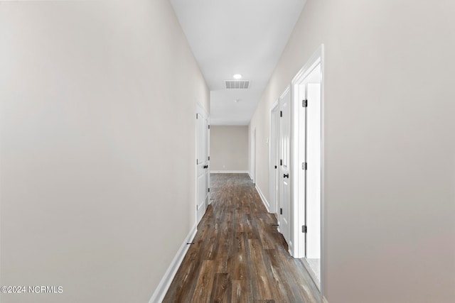 hallway featuring dark hardwood / wood-style floors