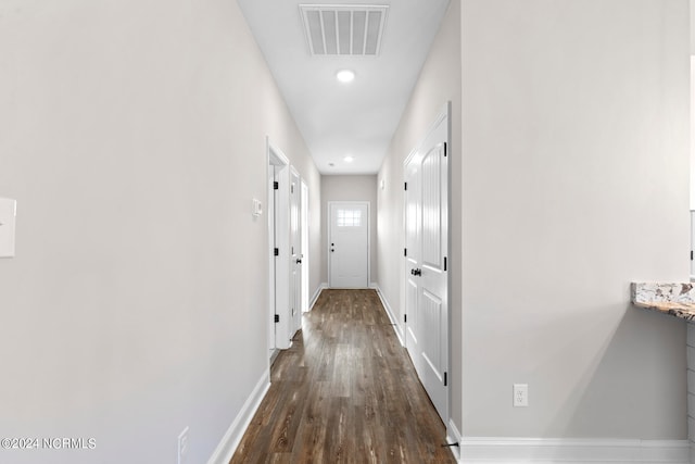 hall with dark hardwood / wood-style flooring