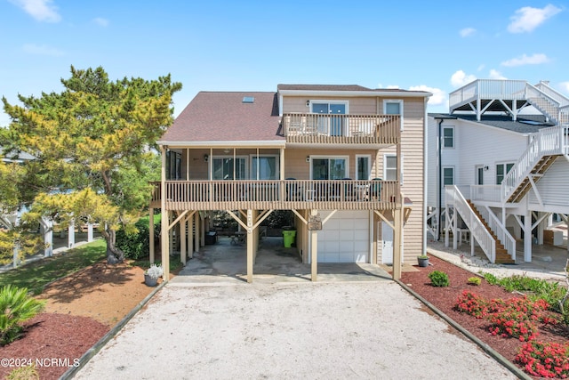 view of front of house with a carport and a garage