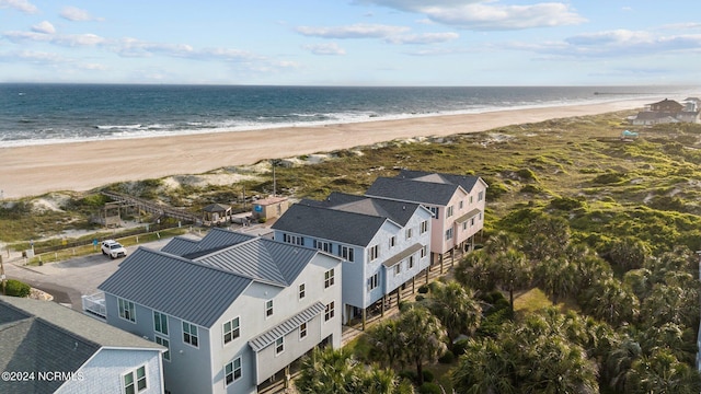 aerial view featuring a water view and a beach view