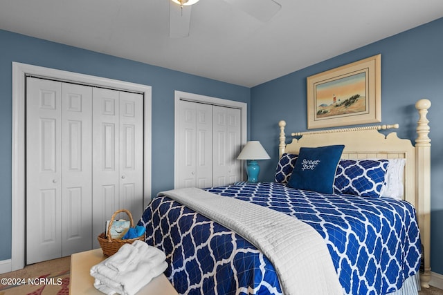 bedroom with multiple closets, ceiling fan, and carpet floors