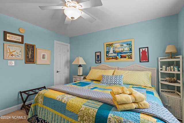 carpeted bedroom featuring ceiling fan