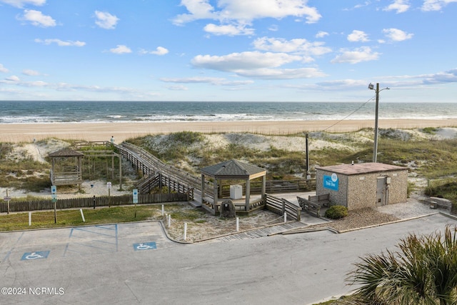 bird's eye view featuring a water view and a view of the beach