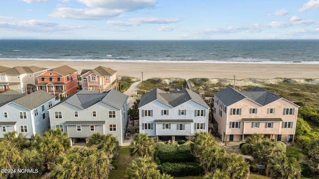 aerial view featuring a view of the beach and a water view