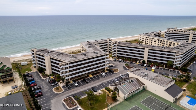 birds eye view of property with a view of the beach and a water view