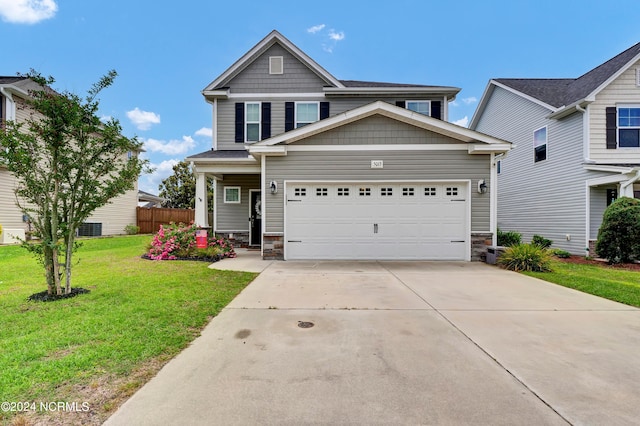 craftsman-style house featuring a front yard and a garage