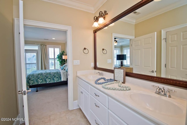 bathroom with tile patterned flooring, ornamental molding, and vanity