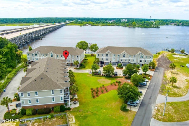 birds eye view of property featuring a water view