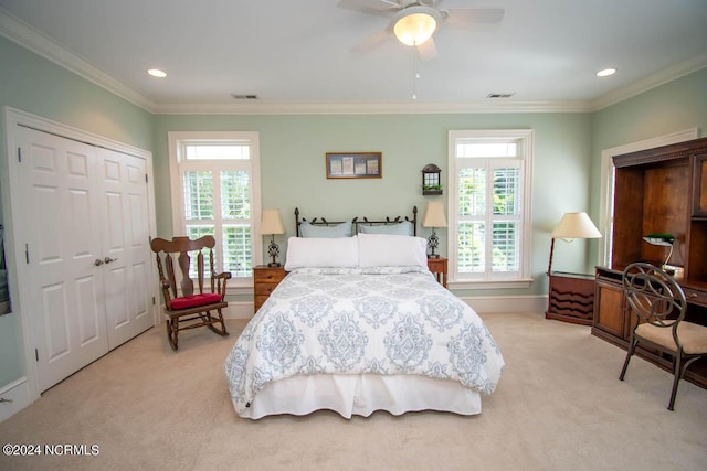 bedroom featuring crown molding, light colored carpet, a closet, and ceiling fan