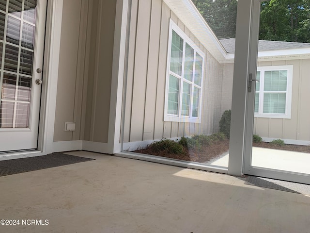 property entrance featuring a patio area