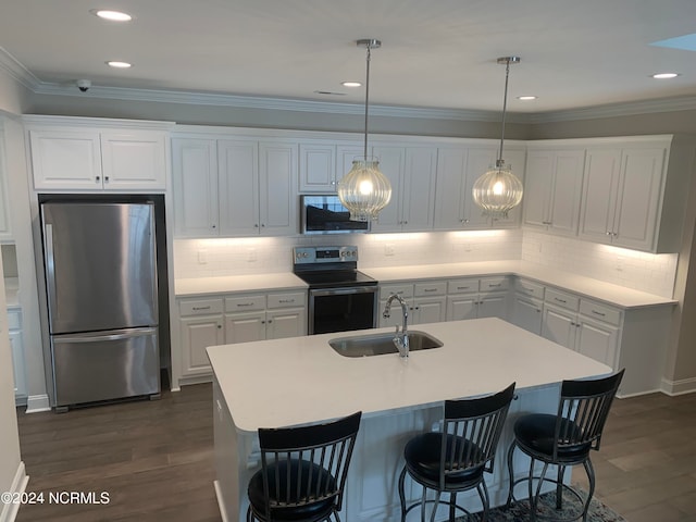 kitchen with white cabinetry, sink, tasteful backsplash, and stainless steel appliances