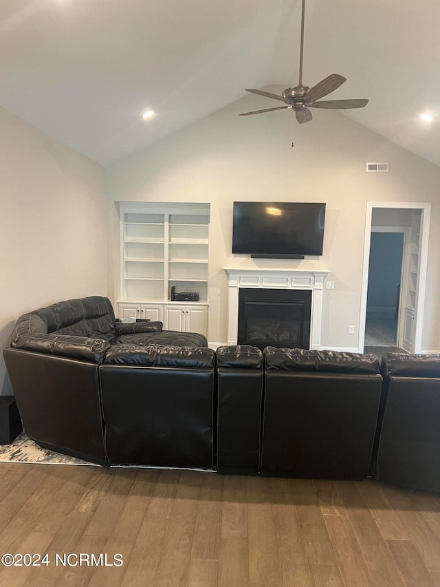 living room featuring ceiling fan, vaulted ceiling, and hardwood / wood-style floors