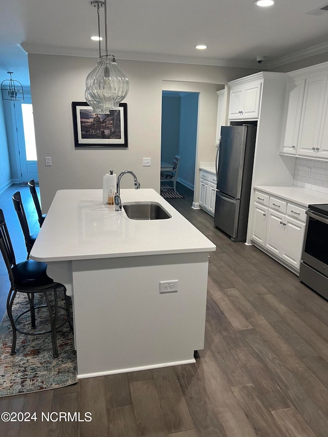 kitchen with stainless steel electric range oven, dark wood-type flooring, black fridge, sink, and white cabinetry