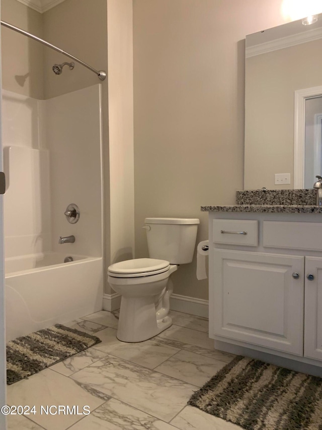 full bathroom featuring shower / washtub combination, toilet, tile floors, ornamental molding, and vanity