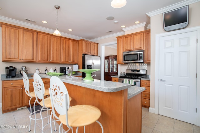 kitchen with stainless steel appliances, hanging light fixtures, light tile flooring, and backsplash