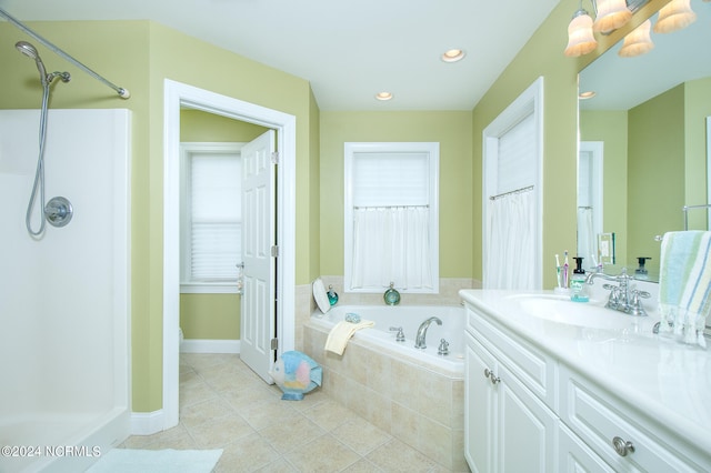 bathroom featuring tile flooring, a relaxing tiled bath, and oversized vanity