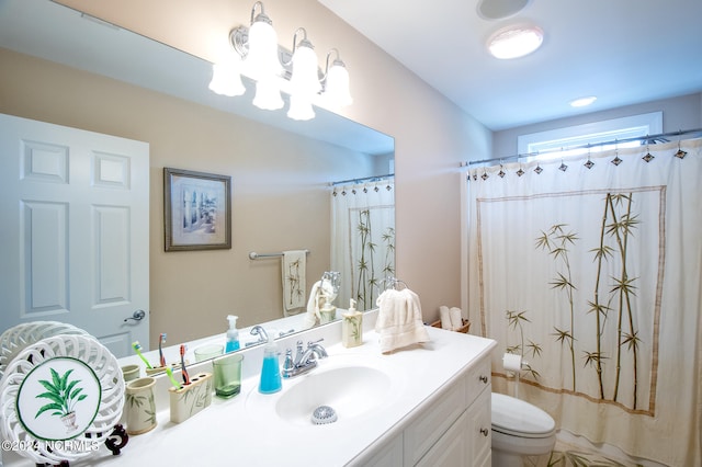 bathroom featuring vanity and toilet