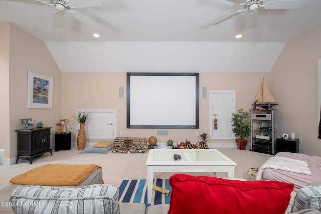 cinema room with ceiling fan, carpet floors, and lofted ceiling