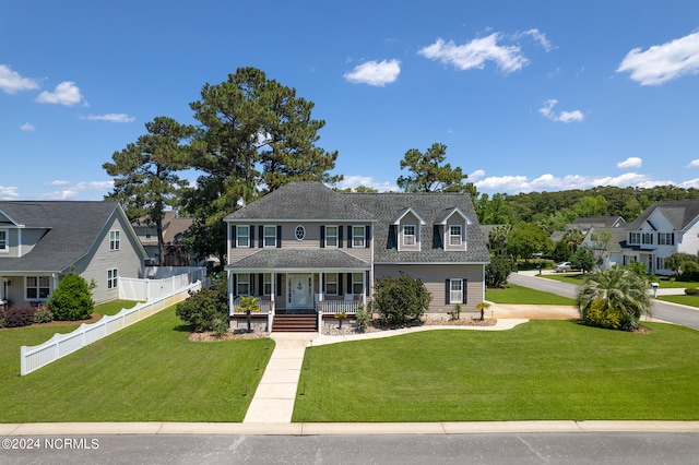 view of front of home featuring a front lawn and covered porch