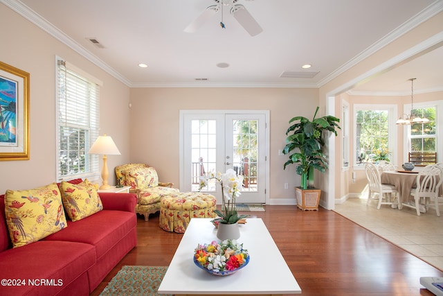 living room with hardwood / wood-style floors and ornamental molding