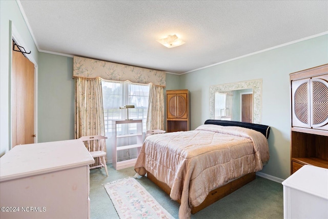 carpeted bedroom with a textured ceiling and crown molding