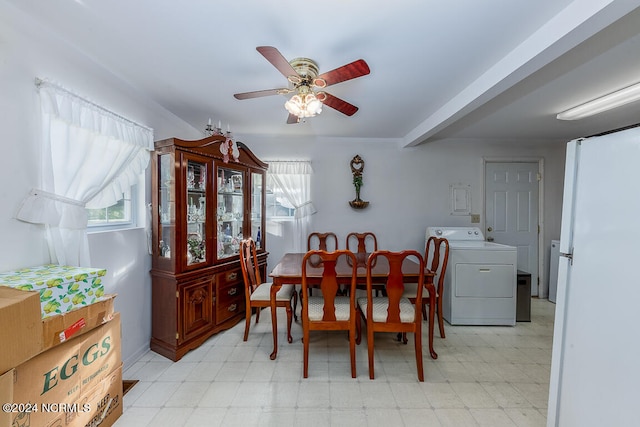 dining space featuring ceiling fan, light tile floors, and washer / clothes dryer