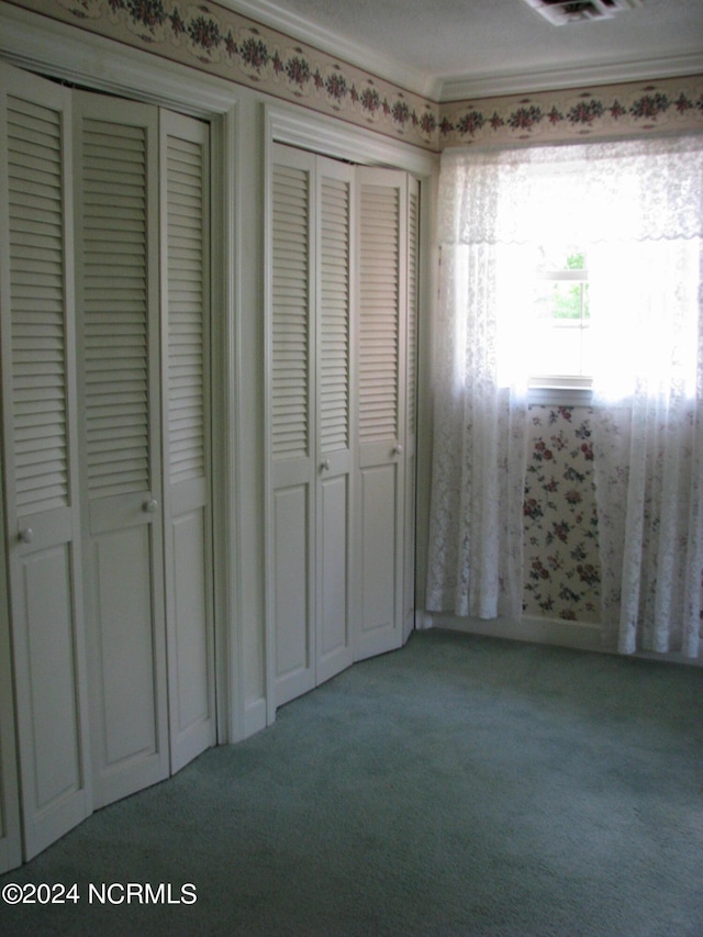 unfurnished bedroom featuring light colored carpet