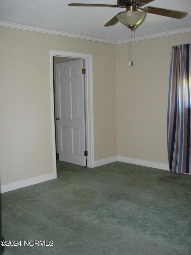 carpeted empty room featuring ceiling fan and ornamental molding