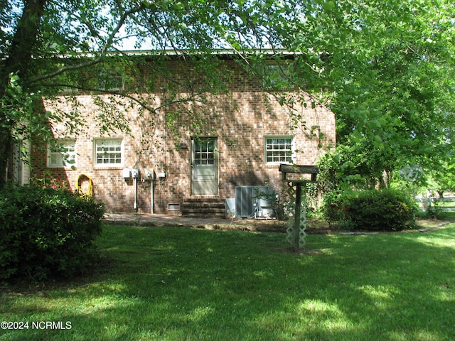 back of house with a yard