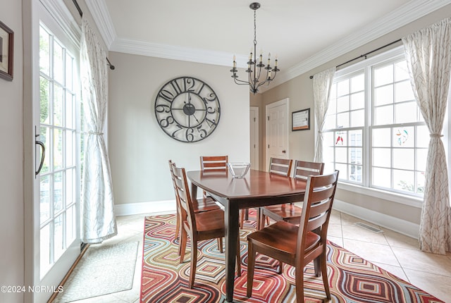 tiled dining area with crown molding, plenty of natural light, and an inviting chandelier