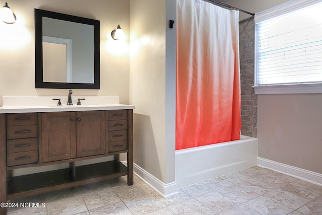 bathroom with tile flooring, shower / tub combo, and vanity