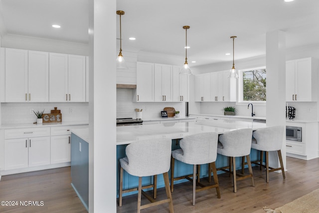 kitchen with a center island and white cabinets