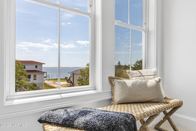 living area featuring a water view