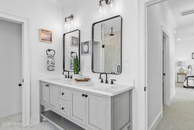 bathroom with vanity, a shower with door, and ornamental molding