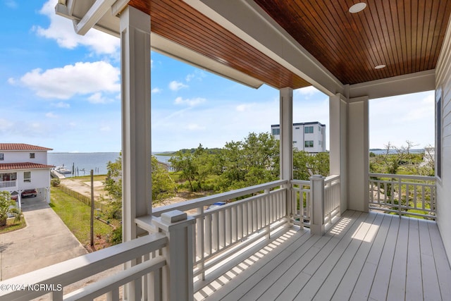 wooden terrace with a water view