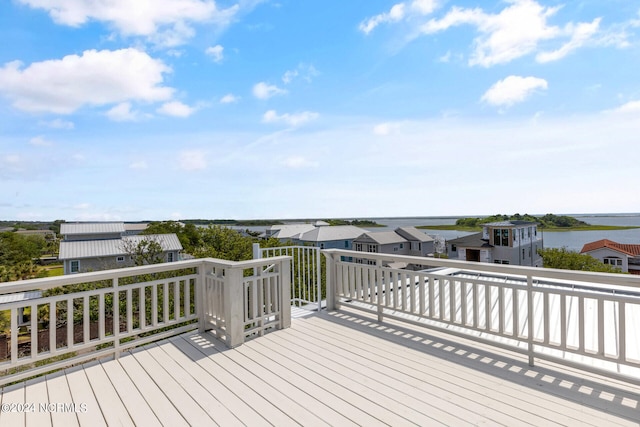 wooden deck with a water view