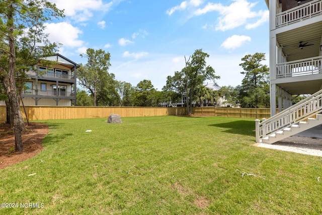 back of property featuring a lawn and a balcony